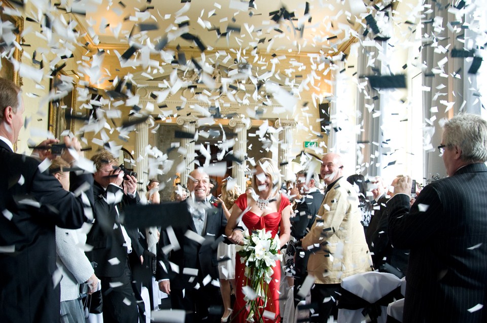 alternative-confetti-ideas-married-couple-showered-in-black-and-white-confetti.jpg